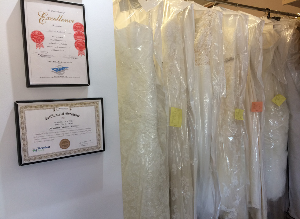 Cleaned and rejuvenated wedding dresses waiting to be collected